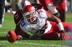 Arkansas' Dennis Johnson loses a fumble in the second quarter of the Razorbacks' loss to South Carolina on Saturday. 