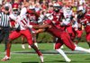 Arkansas Democrat-Gazette/STEPHEN B. THORNTON -- Arkansas' Cobi Hamilton, (11) runs by South Carolina' DeVonte Holloman , right, during the first quarter of their game Saturday afternoon in South Carolina. 