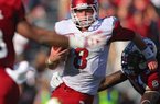 Arkansas Democrat-Gazette/STEPHEN B. THORNTON -- Arkansas QB Tyler Wilson eludes South Carolina defenders in the the third quarter during their game Saturday afternoon in South Carolina. 