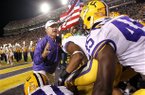 LSU head coach Les Miles leads his team out onto the field before their NCAA college football game against Mississippi State in Baton Rouge, La., Saturday, Nov. 10, 2012. (AP Photo/Gerald Herbert)
