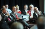University of Arkansas chancellor G. David Gearhart, from left, athletics director Jeff Long, and former head football coach John L. Smith listen during a Sept. 14, 2012 ceremony for the university's new football center in Fayetteville.