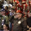 David Ennis, (above center), ret. U.S. Navy, of Bentonville salutes during the playing of “Taps” on ...