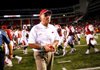 STAFF PHOTO JASON IVESTER
Arkansas head coach John L. Smith walks off the field following the Razorbacks' 35-26 loss to Rutgers on Saturday, Sept. 22, 2012, at Donald W. Reynolds Razorback Stadium in Fayetteville.