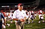 STAFF PHOTO JASON IVESTER
Arkansas head coach John L. Smith walks off the field following the Razorbacks' 35-26 loss to Rutgers on Saturday, Sept. 22, 2012, at Donald W. Reynolds Razorback Stadium in Fayetteville.