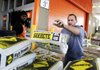 A Home Depot customer tosses a bag of concrete mix onto his truck in Washington, D.C. on Monday. Home Depot reported $947 million in third-quarter net income on Tuesday. 