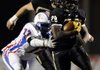 STAFF PHOTO MARC F. HENNING -- Bentonville running back Tearris Wallace, 29, shakes West Memphis defensive end Tristan Williams, 72, during the second quarter of the Tigers' game Friday, Nov. 18, 2011, against the Blue Devils at Tiger Stadium in Bentonville