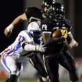 STAFF PHOTO MARC F. HENNING -- Bentonville running back Tearris Wallace, 29, shakes West Memphis def...