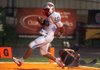 STAFF PHOTO JASON IVESTER -- Fort Smith Southside junior quarterback Issac Jackson scampers into the end zone for a touchdown past the tackle attempt from senior defensive back Utah Julius during the first half on Friday, Aug. 31, 2012, at David Gates Stadium in Rogers.
