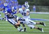 Bryant receiver K.J. Hill (left) is tackled by Conway safety (28) after catching a pass during a Aug. 31, 2012 game at Hornet stadium in Bryant.