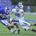 Bryant receiver K.J. Hill (left) is tackled by Conway safety (28) after catching a pass during a Aug...