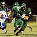 Greenland’s Calvin Giddens, center, runs against Mountain View on Oct. 5 at Greenland. 