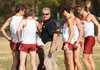 Arkansas Coach Chris Bucknam (center) and the Razorbacks are ranked 11th nationally heading into Saturday’s race. 