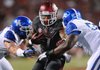 Running back Knile Davis (center), who has missed two games with a hamstring injury, has been cleared to play Saturday, Coach John L. Smith said. 