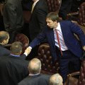 State Rep. Davy Carter is greeted by fellow legislators at the Capitol on Thursday after being elect...