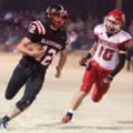Austin Easterling, left, of Pea Ridge, runs past Heber Springs defensive back Micah Dew on Friday at...