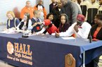 Kate Weber (second from left), Tyler Scaife (center) and Bobby Portis (second from right) all signed national letters of intent to play college basketball Friday. Portis signed with Arkansas while Scaife signed with Rutgers and Weber with Missouri State.
