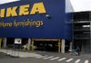 A customer moves his purchases outside the Ikea store in Brooklyn, N.Y., in September. The com2pany said it regrets that some of its products were made using East German prison labor decades ago. 