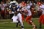 11/16/12
Arkansas Democrat-Gazette/STEPHEN B. THORNTON
North Little Rock's Juan Day breaks away from Cabot defenders to score a first half touchdown during their game Friday night in North Little Rock.