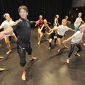 Choreographer and dancer Bill Hastings, left, leads a group of students Oct. 14 through a series of ...
