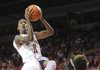 NWA Media/ANDY SHUPE -- Arkansas sophomore guard BJ Young (11) floats to the goal on Sunday, Nov. 18, 2012, during the first half of play in Bud Walton Arena.
