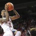 NWA Media/ANDY SHUPE -- Arkansas sophomore guard BJ Young (11) floats to the goal on Sunday, Nov. 18...