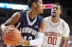 NWA Media/ANDY SHUPE -- Arkansas sophomore guard Rashad Madden (00) pressures Longwood junior guard Tristan Carey after the ball was inbounded Sunday, Nov. 18, 2012, during the first half of play in Bud Walton Arena.