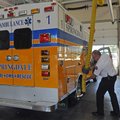 Battalion Chief Jim Vaughn demonstrates Thursday how the exhaust ventilation hose attaches by magnet...