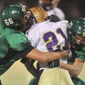 Tylor McClanahan, left, and Kayden Dennis,
Greenland defenders, stop Osceola running back Shaquille...