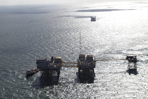 this-aerial-photograph-shows-an-oil-rig-damaged-from-an-explosion-and-fire-in-the-gulf-of-mexico-about-25-miles-southeast-of-grand-isle-la-friday-nov-16-2012-four-people-were-transported-to-a-hospital-with-critical-burns-and-two-were-missing