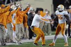 Tennessee head coach Derek Dooley, second from right, pulls linebacker Jacques Smith off the field during an NCAA college football game against Vanderbilt at Vanderbilt Stadium in Nashville , Saturday, Nov. 17, 2012. (AP Photo/Knoxville News Sentinel, Amy Smotherman Burgess)