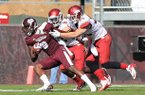 Arkansas Democrat-Gazette/RICK MCFARLAND --11/17/12-- Arkansas's Will Hines (9) and Ross Rasner (35) hang onto Mississippi State's Chris Smith (8) after he caught a pass in their game at Davis Wade Stadium in Starkville, Miss.