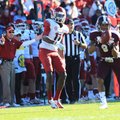 Arkansas Coach John L. Smith (left) reacts as Mississippi State’s Darius Slay (9) intercepts a fourt...