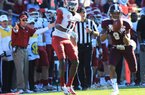 Arkansas Coach John L. Smith (left) reacts as Mississippi State’s Darius Slay (9) intercepts a fourth-quarter pass from Tyler Wilson intended for Cobi Hamilton (11). Slay’s 15-yard return was nullified by a Mississippi State personal foul, but Nick Griffin scored on a 60-yard run on the next play, giving the Bulldogs a 45-14 lead. 