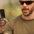 Rick Spicer describes the basic features of a compass Sunday during an outdoor survival skills class...