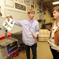 Mason Hollis, left, a Fayetteville High School senior, describes the Aurasma photo identification sy...