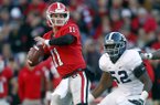 Georgia quarterback Aaron Murray (11) throws under pressure from Georgia Southern defensive end Javon Mention (52) in the second half of an NCAA college football game on Saturday, Nov. 17, 2012, in Athens, Ga. (AP Photo/John Bazemore)