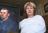 Fran Marshall, president of the Arkansas Chapter of American Gold Star Mothers Inc., a private nonprofit organization of women who have lost a child due to war, poses with a photograph of her son, Bradley, who died in Tunis, Iraq, in 2007 at age 37 of wounds he sustained from enemy mortar fire. 