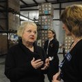 Marge Wolf, (right) left, president and CEO of the Northwest Arkansas Food Bank, talks with Gaye Wil...