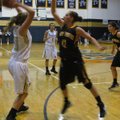Prairie Grove's Whitnee Fitts, right, defends Shiloh Christian's Cayden Sears during Tuesday night's...