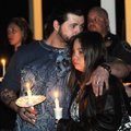 Mike Bridgeman, left, uncle of Jersey Bridgeman, kisses Laurie Caancan on the top of the head Tuesda...