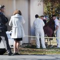Benton County Coroner’s office employees prepare to remove the body of a 6-year-old girl Tuesday nea...