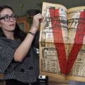 In this photo taken Tuesday, Nov. 20, 2012 Alissa Williams holds up a an advertising flyer from T.K....