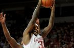 NWA Media/ANTHONY REYES -- Arkansas junior Marshawn Powell (33) drives to the basket as Florida A&M senior Markee Teal defends in the first half Tuesday, Nov. 20, 2012 at Bud Walton Arena in Fayetteville.