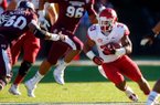 NWA Media/JASON IVESTER -- Arkansas senior running back Dennis Johnson looks for running room against Mississippi State during the fourth quarter on Saturday, Nov. 17, 2012, at Davis Wade Stadium in Starkville, Miss.
