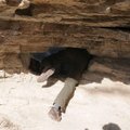 At one point, hikers choose to crawl through a hole in the bluff or take a detour to continue along ...