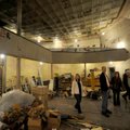 Visitors take a look around the old opera house on the second floor of the old Dixieland shoe store ...