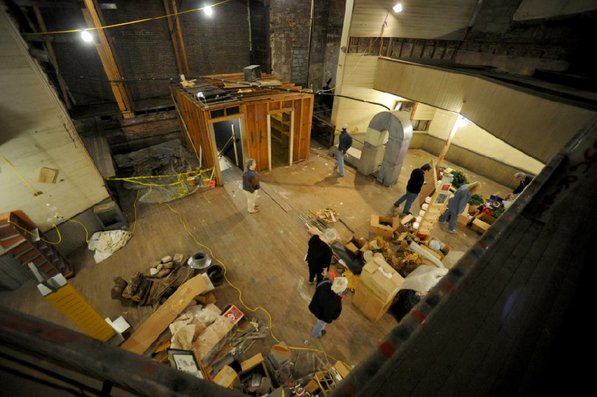
                               
                                  Photo by Michael Woods&mdash;
                               
                           
                           Visitors take a look around the old opera house on the second floor of the old Dixieland shoe store on the corner of Walnut and 1st street in Rogers Wednesday morning.  John Mack, owner of JKJ Architects, recently purchase the former Dixieland Shoe store. He is restoring the building which includes the Opera House on the second floor, once a grand theater.