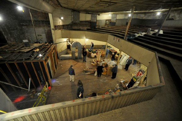 
                               
                                  Photo by Michael Woods&mdash;
                               
                           
                           Visitors take a look around the old opera house on the second floor of the old Dixieland shoe store on the corner of Walnut and 1st street in Rogers Wednesday morning.  John Mack, owner of JKJ Architects, recently purchase the former Dixieland Shoe store. He is restoring the building which includes the Opera House on the second floor, once a grand theater.