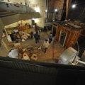 Visitors take a look around the old opera house on the second floor of the old Dixieland shoe store ...