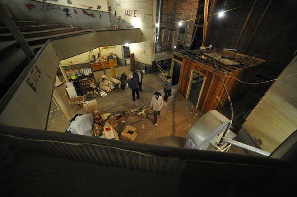 
                               
                                  Photo by Michael Woods&mdash;
                               
                           
                           Visitors take a look around the old opera house on the second floor of the old Dixieland shoe store on the corner of Walnut and 1st street in Rogers Wednesday morning.  John Mack, owner of JKJ Architects, recently purchase the former Dixieland Shoe store. He is restoring the building which includes the Opera House on the second floor, once a grand theater.